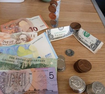 Bank notes and coins from different currencies