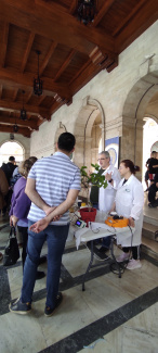 people in front of stands at a science exhibition