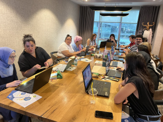 A group of teachers discussing in a seminar room