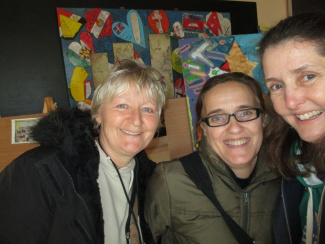 A photo of three smiling teachers