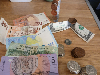 Bank notes and coins from different currencies