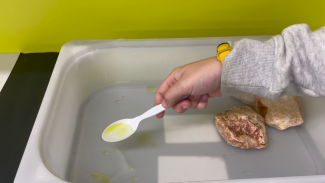 Collecting oil with a spoon