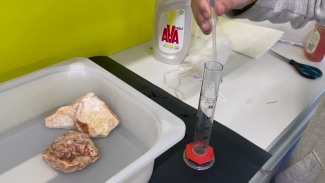 Transferring collected oil into a volumentric cylinder