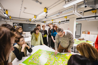 A group of teachers around a table during a workshop