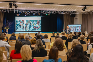 An audience of teachers during a conference